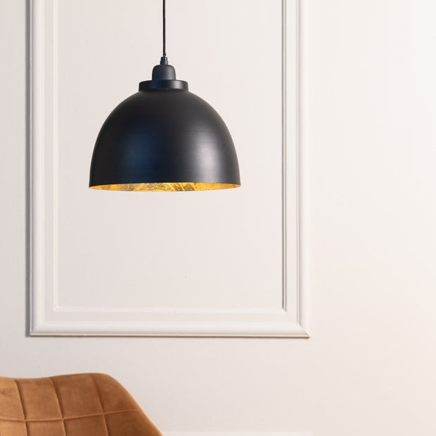 Large black dome ceiling light with a black chain