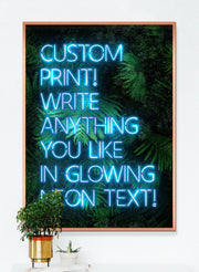 Blue custom neon LED sign art print with a green leaves background
