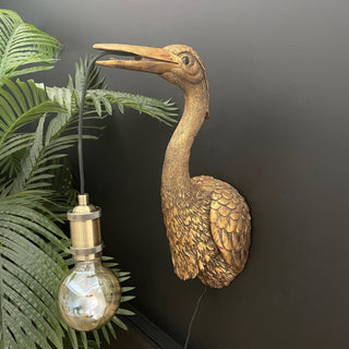 Gold crane wall light