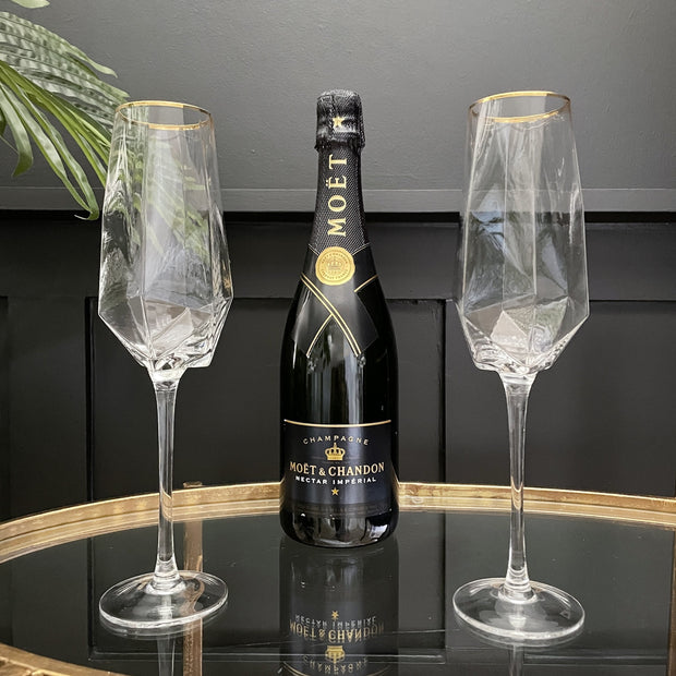 Diamond base champagne glasses with a gold rimmed top