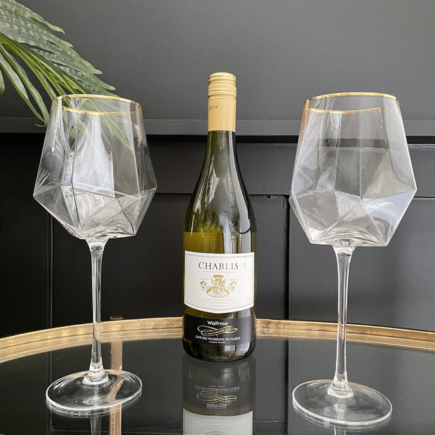 Diamond base wine glasses with a gold rim