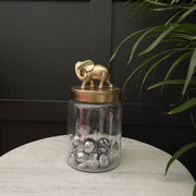 Glass elephant storage jar with a gold lid