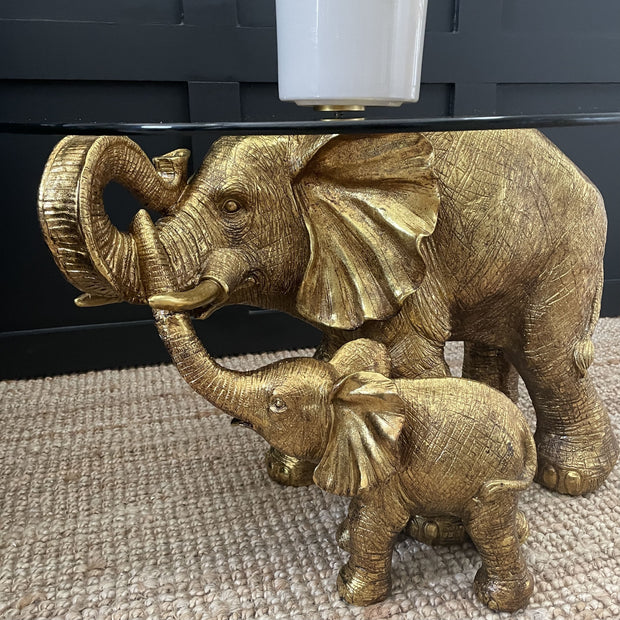 Mum & child gold elephant side table with a round glass top