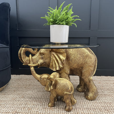 Mum & child gold elephant side table with a round glass top