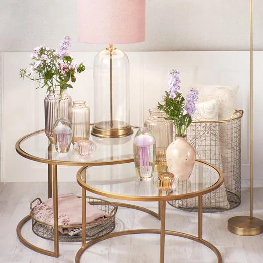 Set of two nesting gold hooped design curved coffee tables with glass shelves