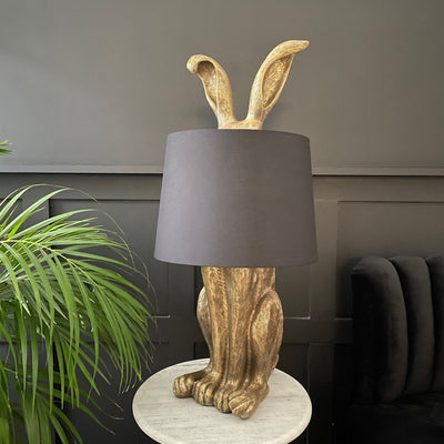 Gold hare lamp with black lampshade 