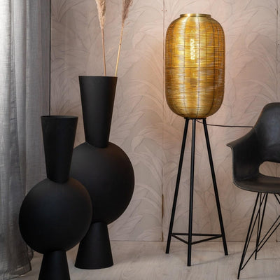Gold woven tripod floor lamp with black legs