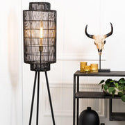 Large black cylindrical lantern light wrapped in black weave effect wire