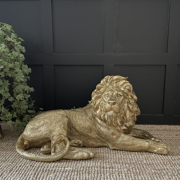 Laying down gold large lion ornament