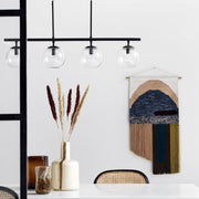 Black long linear pendant light with four glass globes 