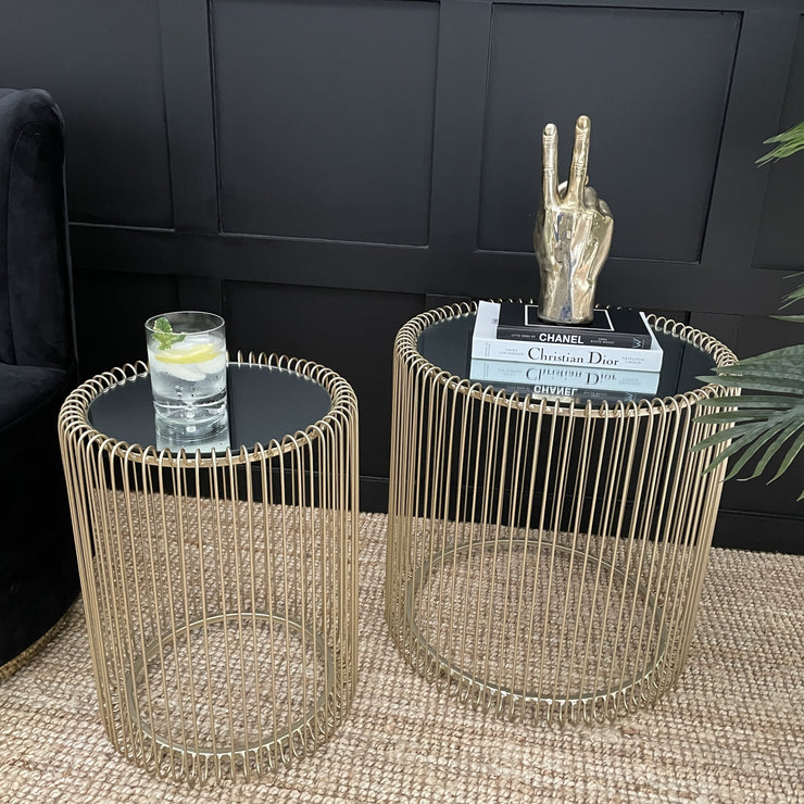 Set of two circular gold wire side tables with mirrored tops