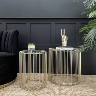 Set of two circular gold wire side tables with mirrored tops