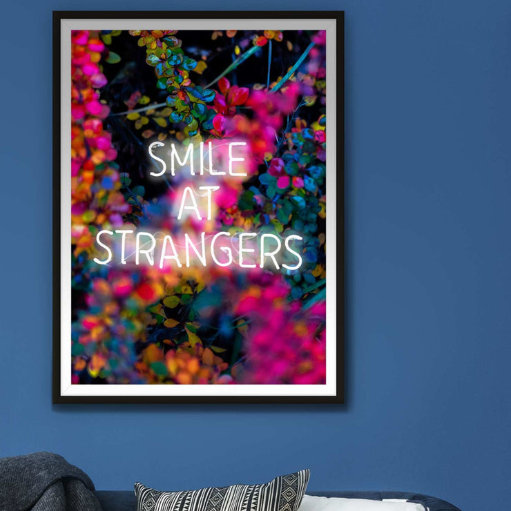 Neon white smile at strangers LED art print with a colourful floral background
