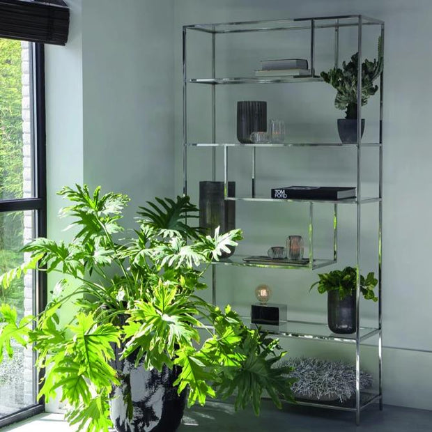 Freestanding nickel silver shelving unit with staggered geometric clear glass shelves