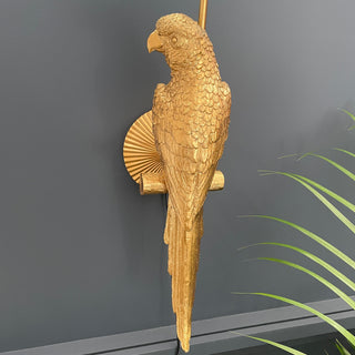 Gold parrot wall light with an aqua blue shade