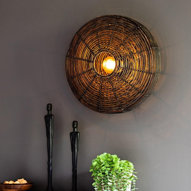 Black circular rattan wall light