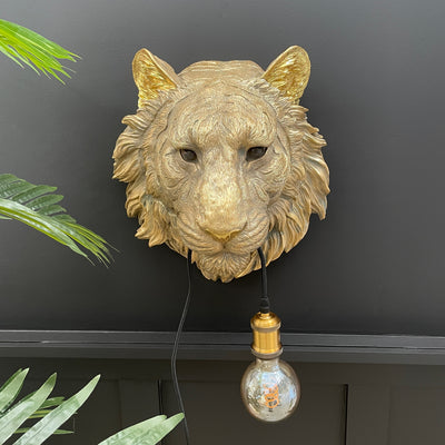 Gold tiger head wall lamp with a bulb in it's mouth
