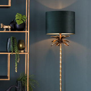 Gold palm tree floor lamp lit