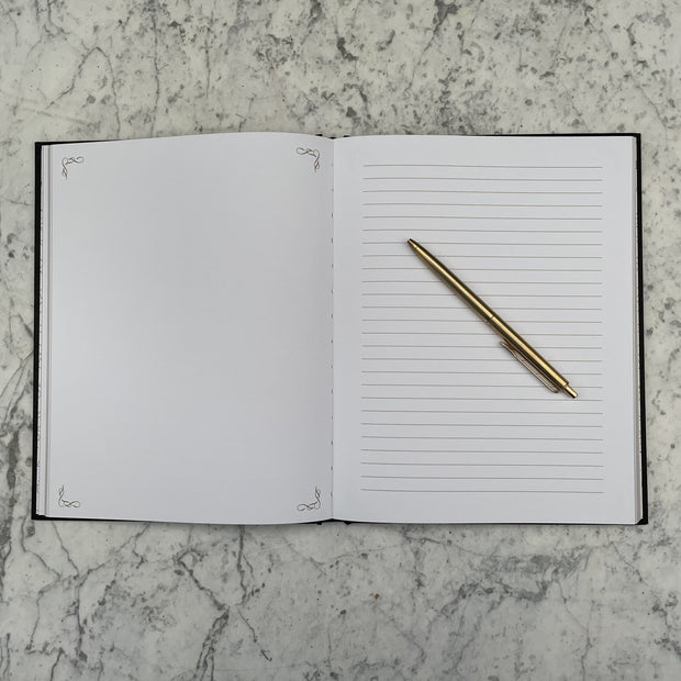You got this shit gold calligraphy black notebook with gold edged paper